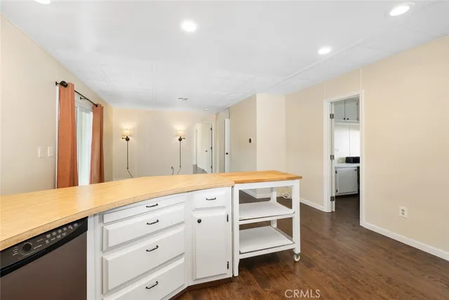a spacious bathroom with a double vanity sink and a mirror