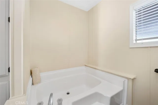 a white bath tub sitting in a bathroom
