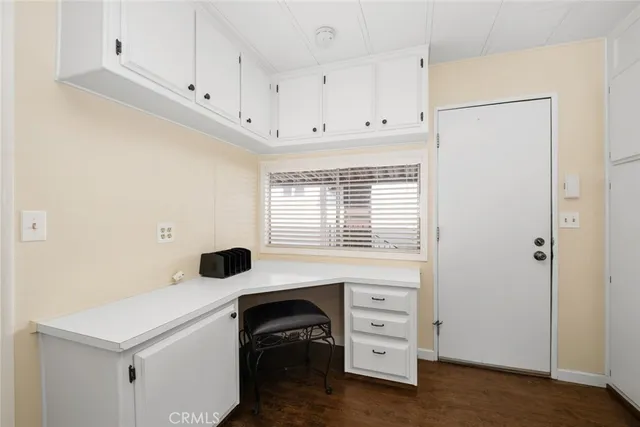 a view of cabinets with wooden floor