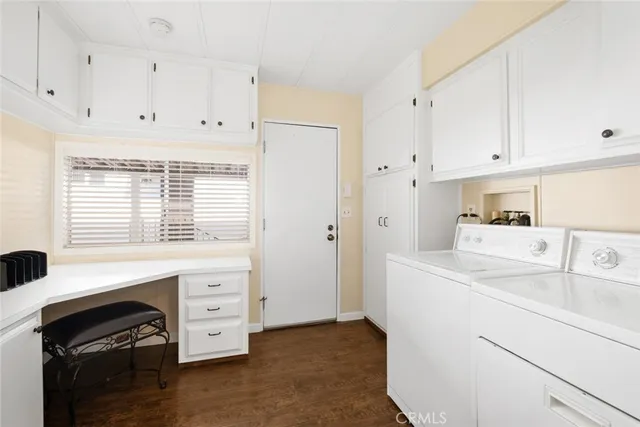 a kitchen with cabinets appliances and a sink