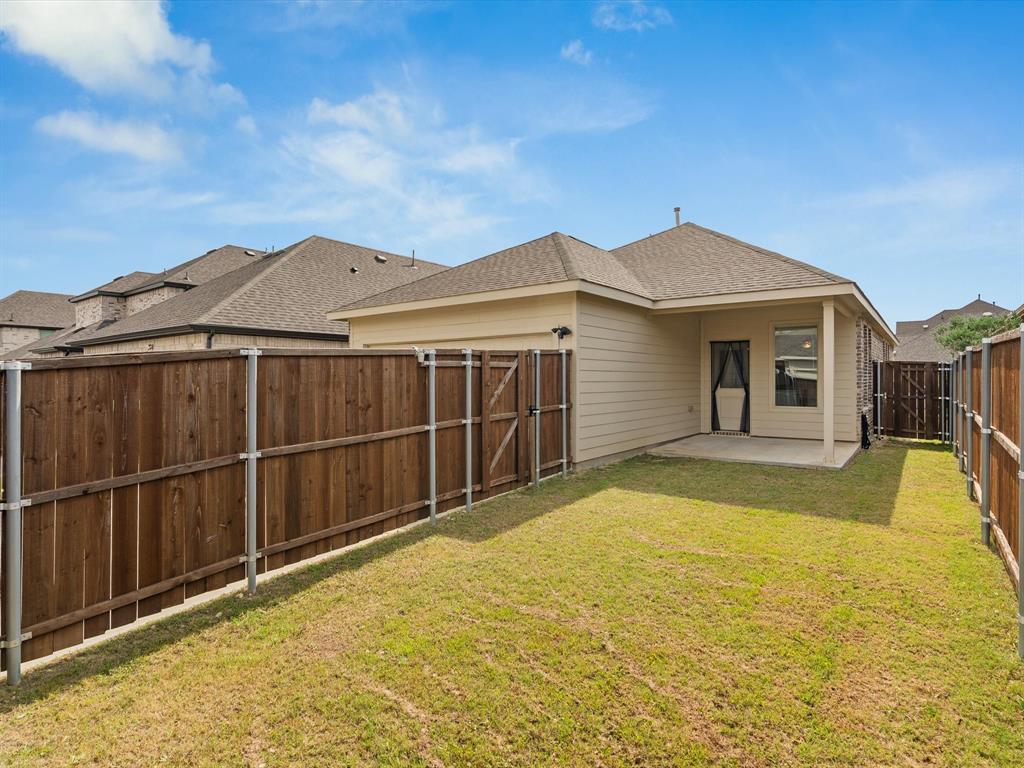 16936 Post Cedar Drive Justin, TX 76247 - Photo 29 of 30 Bedroom featuring crown molding, wood-finish flooring, two large windows, and a ceiling fan with light fixture