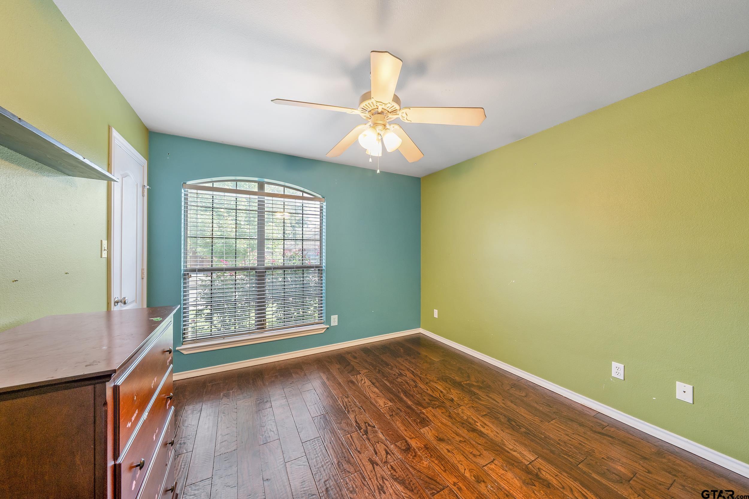 10820 Cactus Trail Flint, TX 75762 - Photo 18 of 29 wooden floor in an empty room with a window