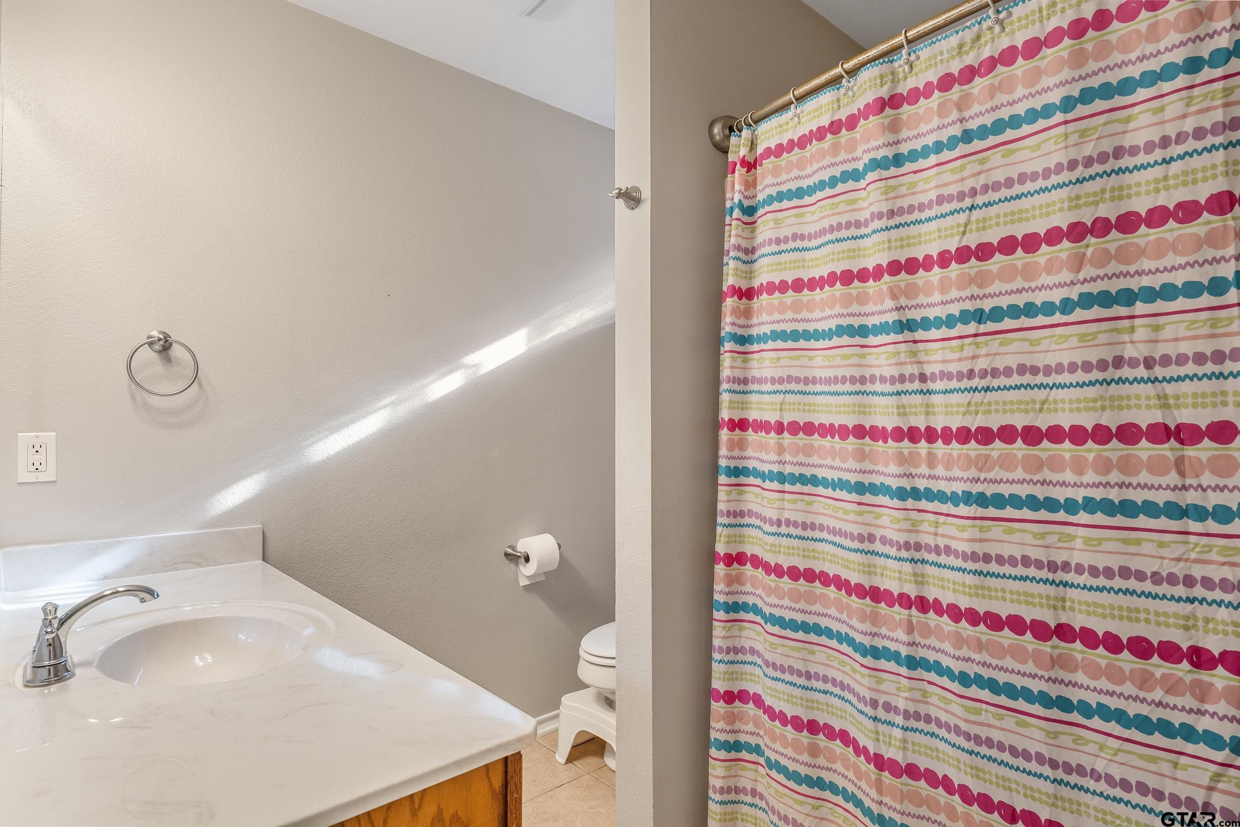 10820 Cactus Trail Flint, TX 75762 - Photo 20 of 29 a bathroom with a sink and a bathtub