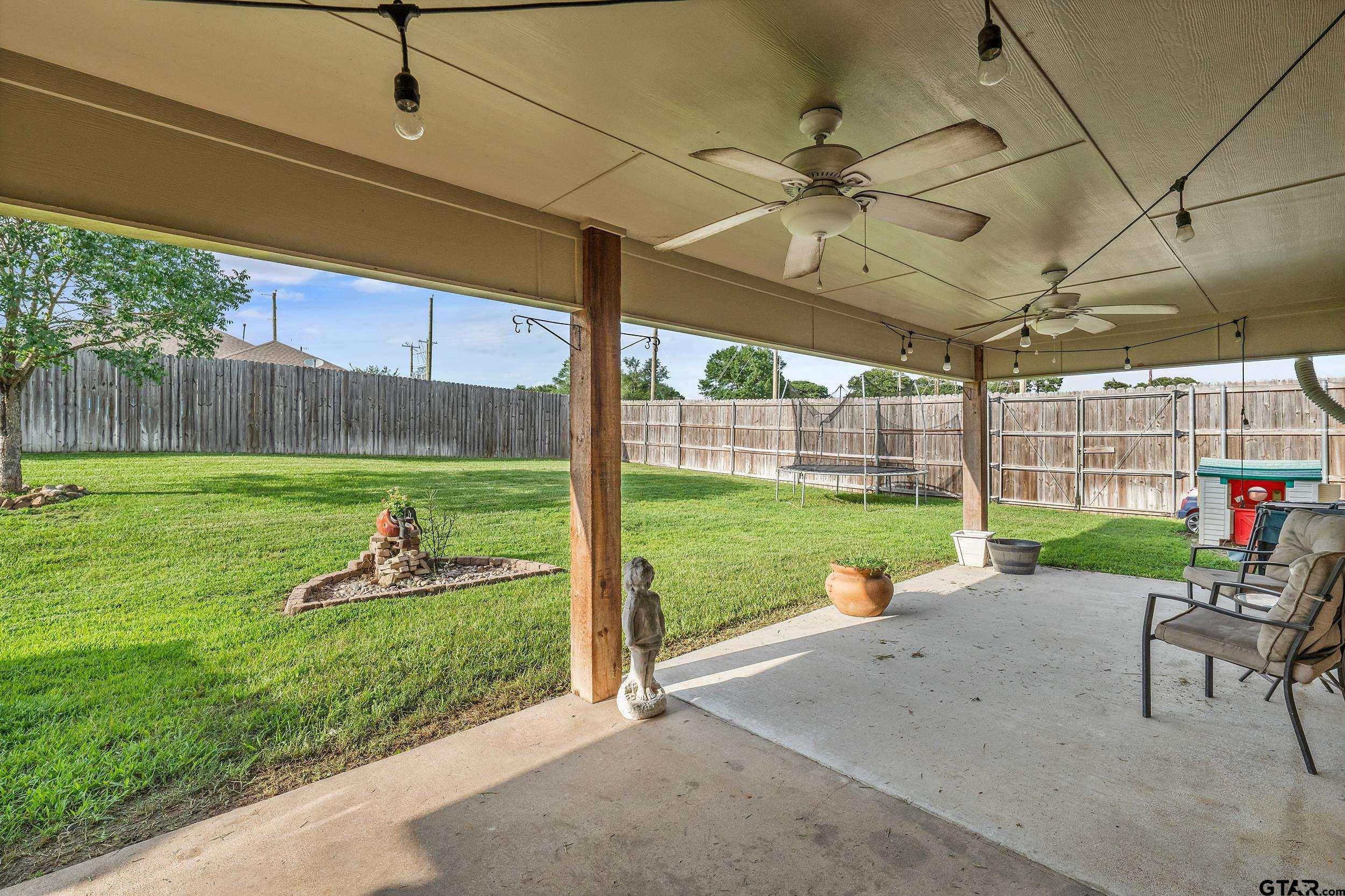 10820 Cactus Trail Flint, TX 75762 - Photo 23 of 29 a view of a backyard with sitting area