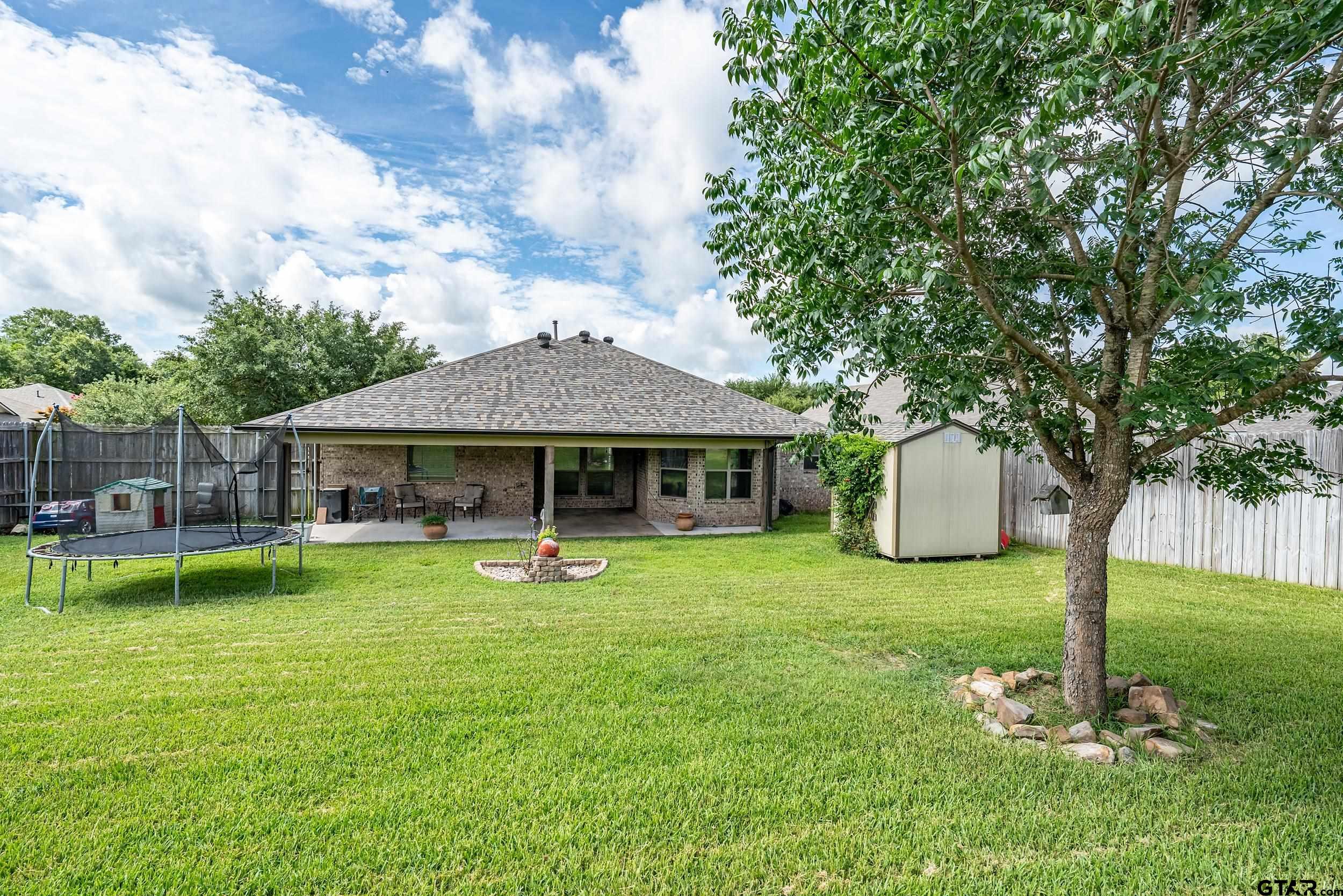10820 Cactus Trail Flint, TX 75762 - Photo 25 of 29 a front view of a house with garden