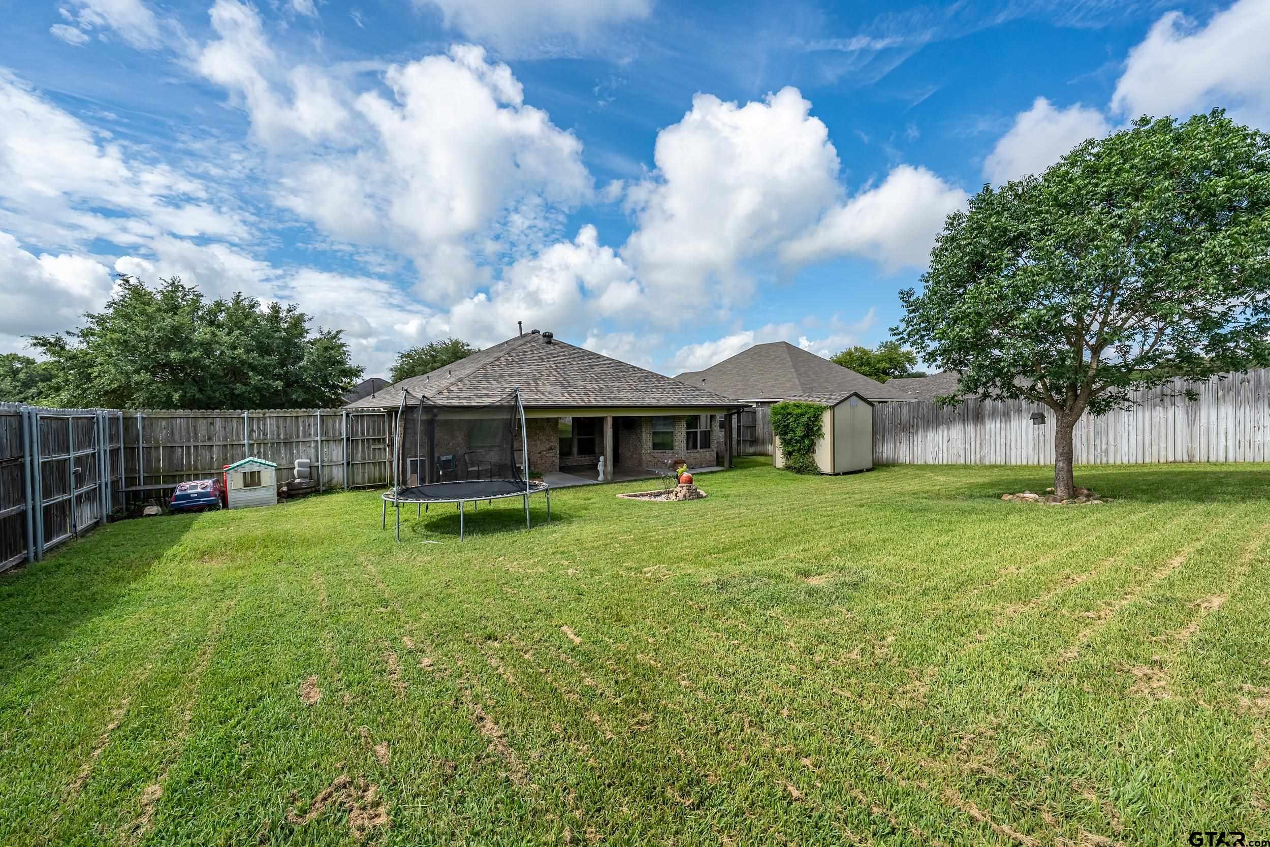 10820 Cactus Trail Flint, TX 75762 - Photo 29 of 29 a view of a house with backyard and garden