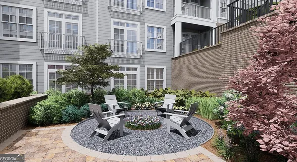 a view of a house with fountain in front of house
