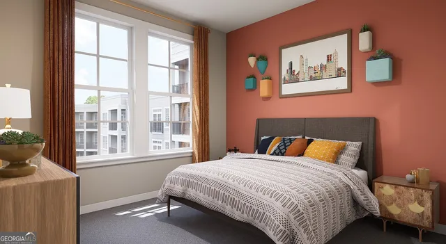 a bedroom with a bed and a large window