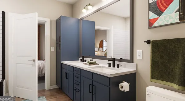 a bathroom with a double vanity sink and mirror