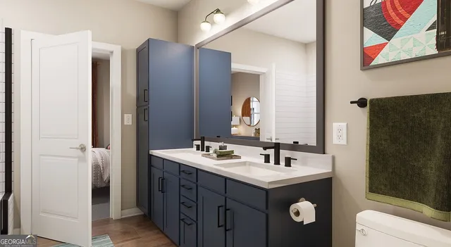 a bathroom with a double vanity sink and mirror
