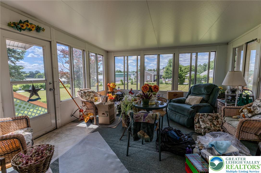 40 Locke Heights Road Bangor, PA 18013 - Photo 14 of 28 Sun-filled sun room offers views of the surrounding neighborhood and yard.