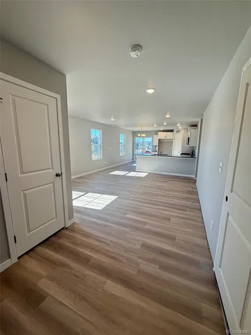 a view of a livingroom with wooden floor