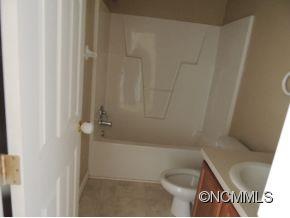 100 Hunter's Trail Tryon, NC 28782 - Photo 7 of 10 a bathroom with a bathtub and shower
