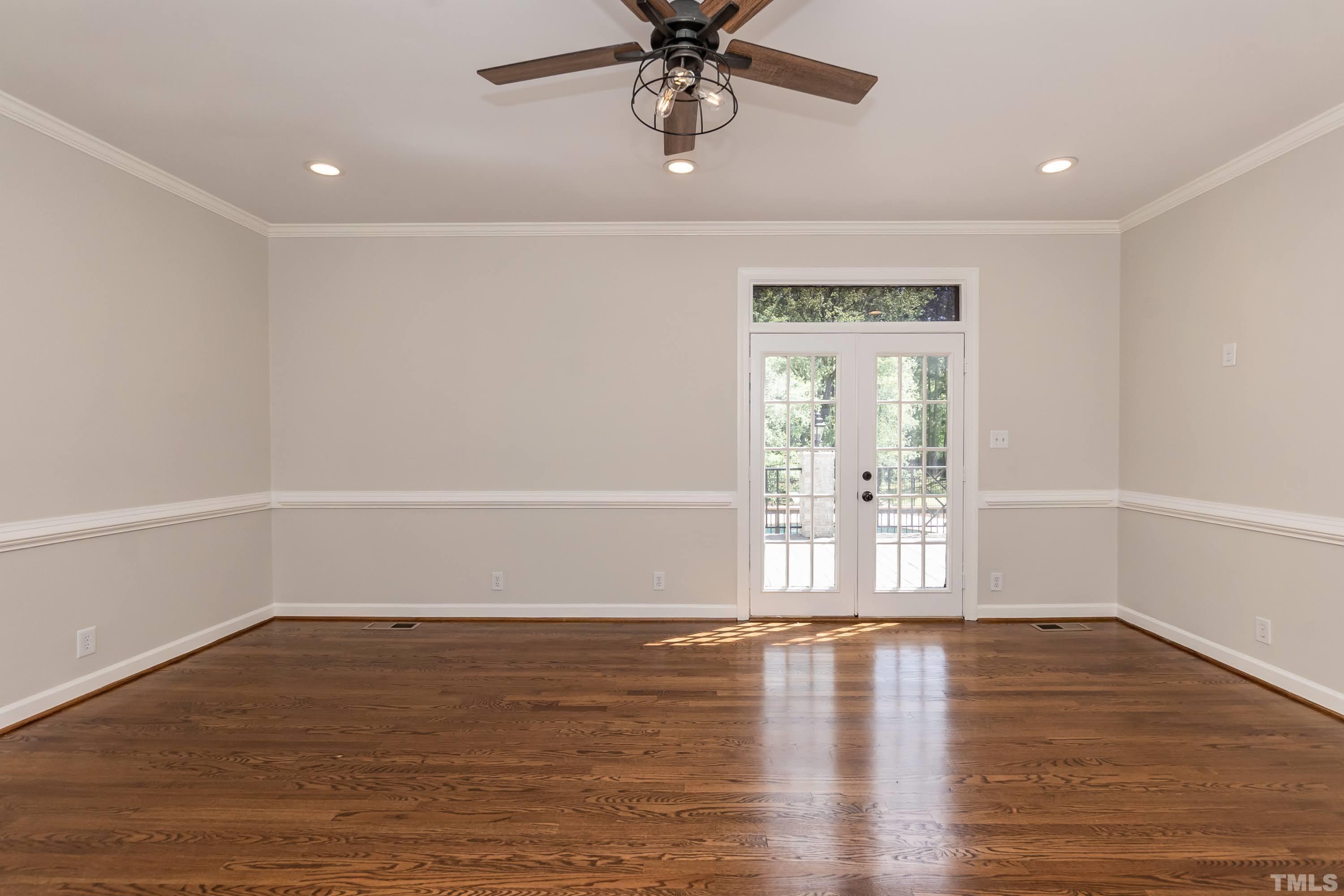 2215 Umstead Road Durham, NC 27712 - Photo 26 of 63 a view of empty room with wooden floor and fan