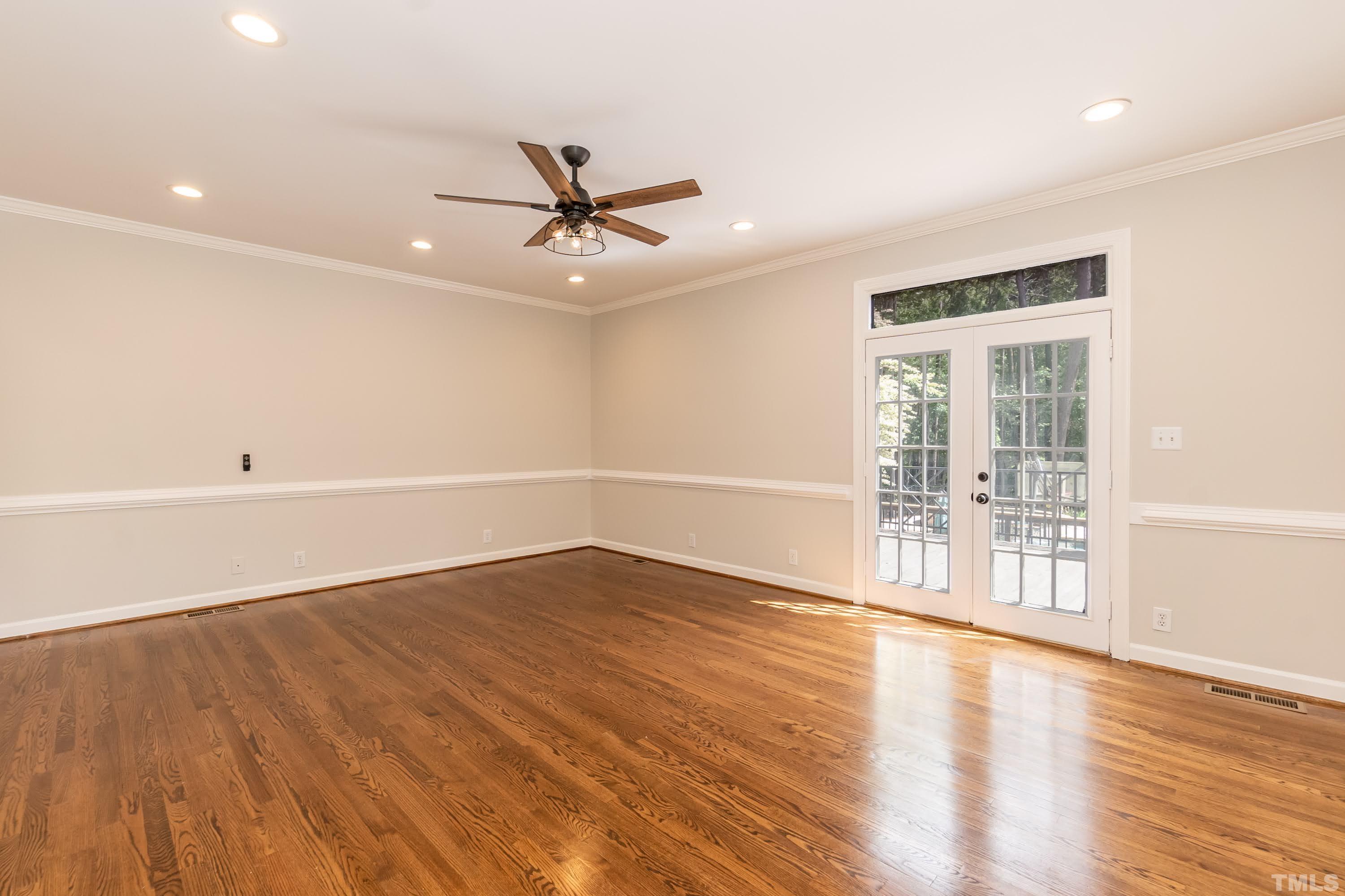2215 Umstead Road Durham, NC 27712 - Photo 27 of 63 an empty room with wooden floor and windows
