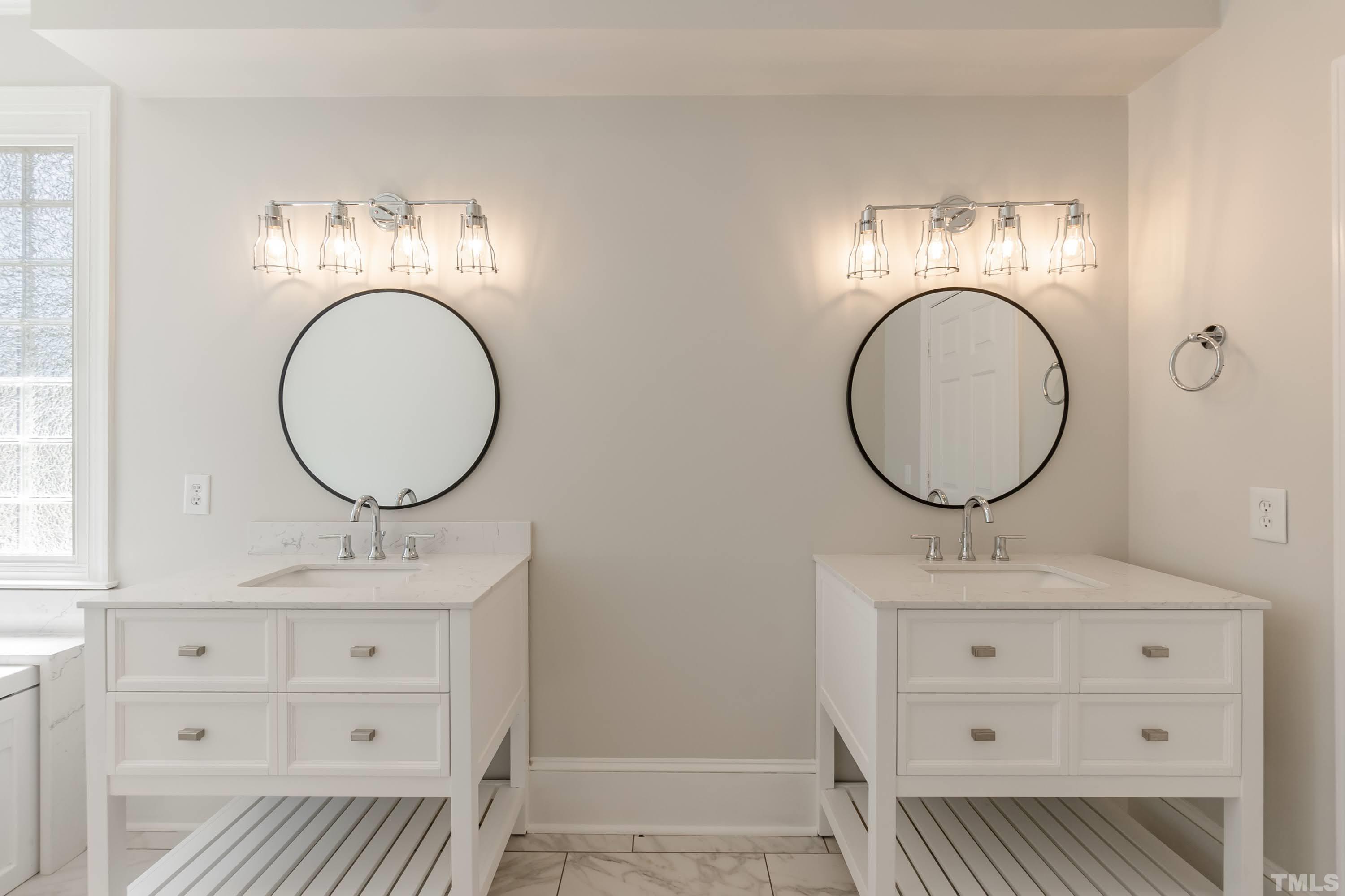 2215 Umstead Road Durham, NC 27712 - Photo 28 of 63 a bathroom with a sink mirror vanity and a mirror