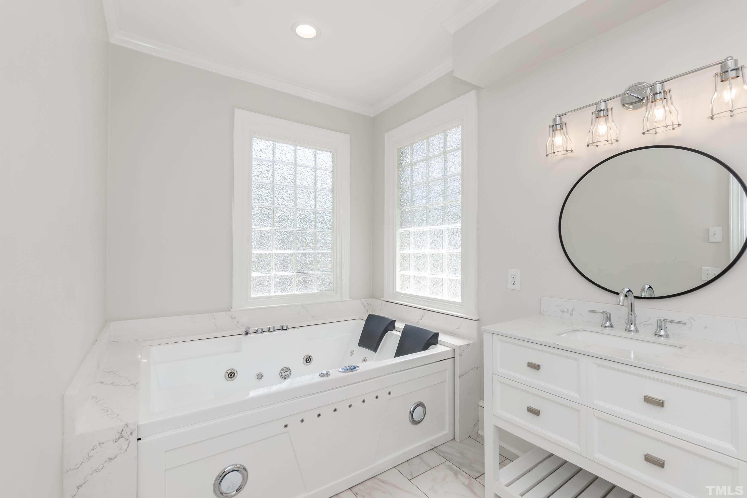 2215 Umstead Road Durham, NC 27712 - Photo 29 of 63 a bathroom with a sink and a mirror