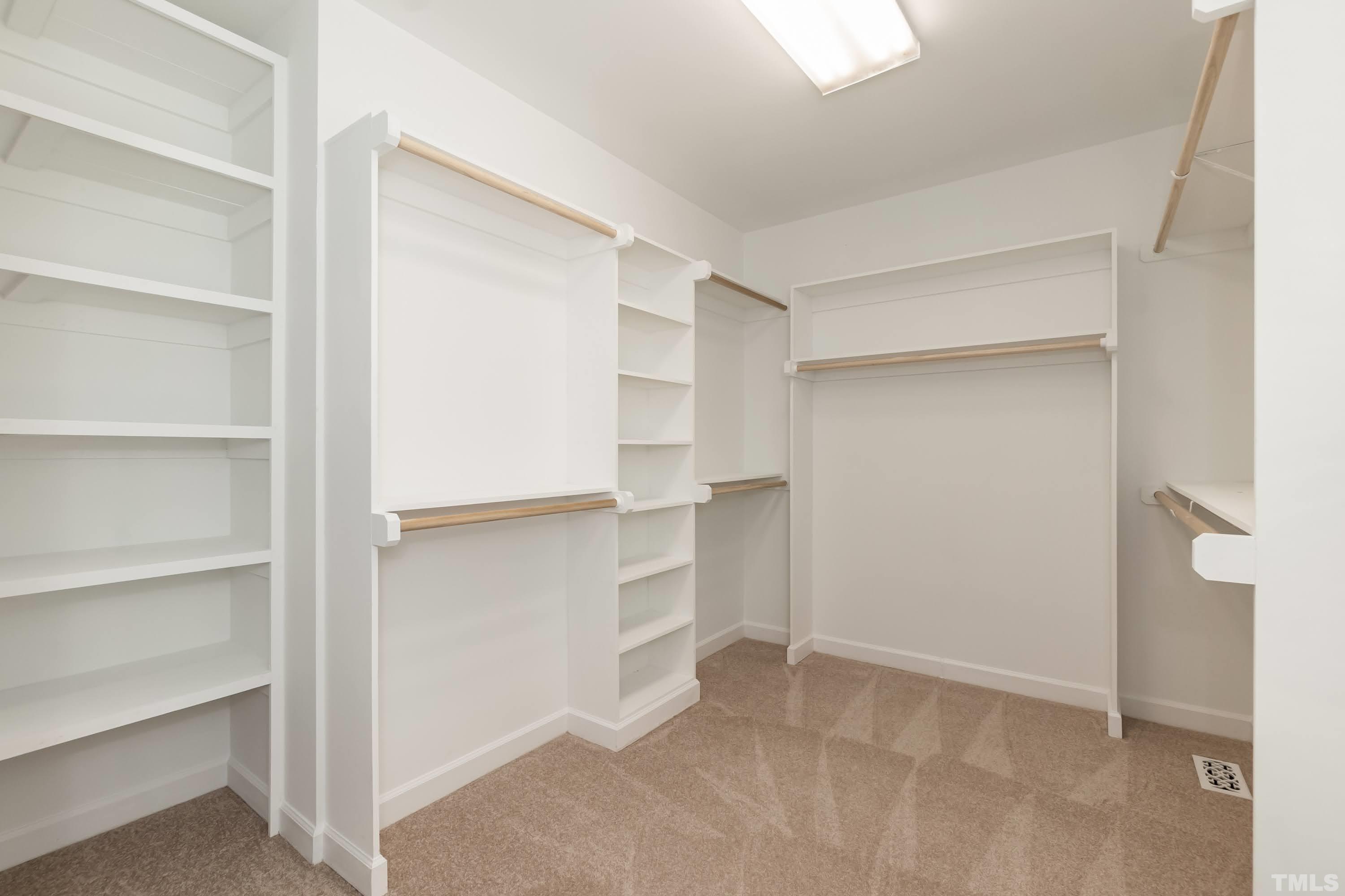 2215 Umstead Road Durham, NC 27712 - Photo 32 of 63 a view of walk in closet with empty racks