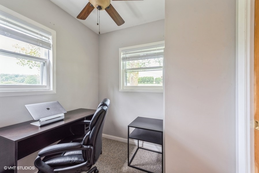 1S866 Green Road Elburn, IL 60119 - Photo 19 of 55 a view of a workspace with furniture and a window