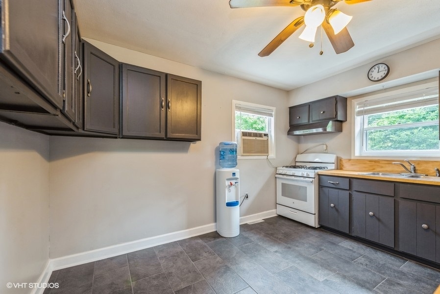 1S866 Green Road Elburn, IL 60119 - Photo 24 of 55 a kitchen with stainless steel appliances a stove a sink and a refrigerator