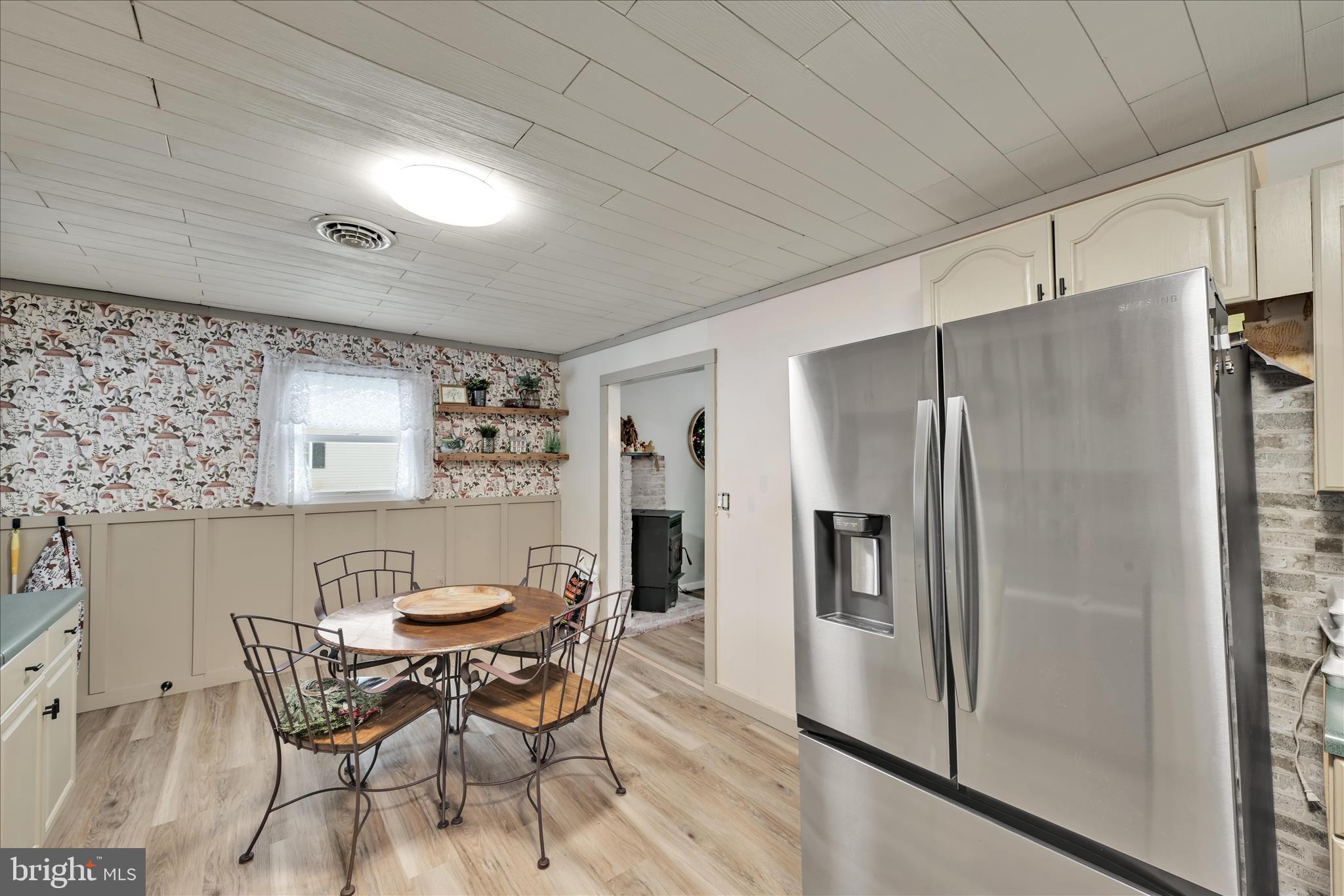 40 Long Stretch Road Pine Grove, PA 17963 - Photo 13 of 37 a dining area with furniture and a refrigerator