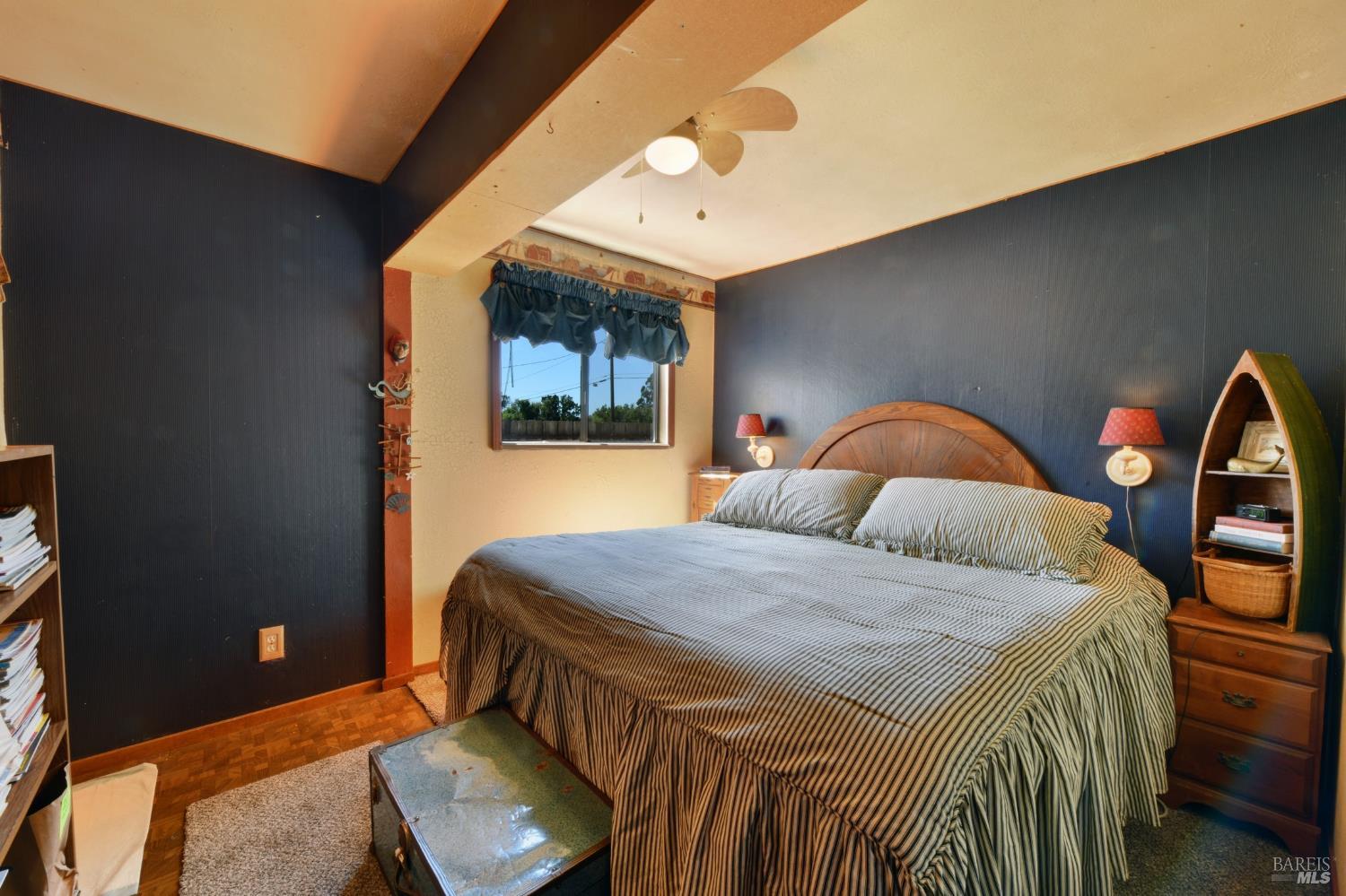 148 Millbrae Avenue Santa Rosa, CA 95407 - Photo 19 of 29 a bedroom with a bed and a dresser with mirror