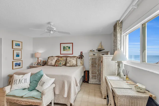 a bedroom with furniture and a chandelier