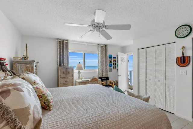 a bed room with a bed and a chandelier