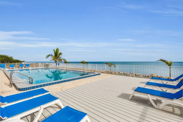 a view of swimming pool with seating space