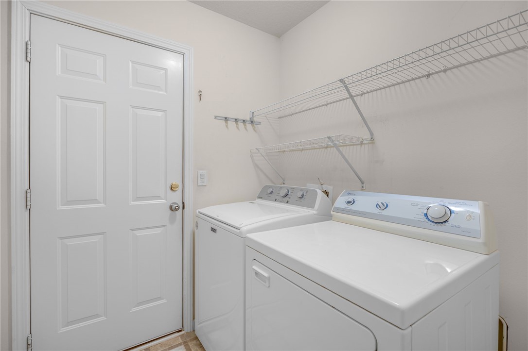 125 Patagonia Road Anderson, SC 29625 - Photo 12 of 36 A dedicated laundry space features wire shelving for organization and easy access to the backyard.