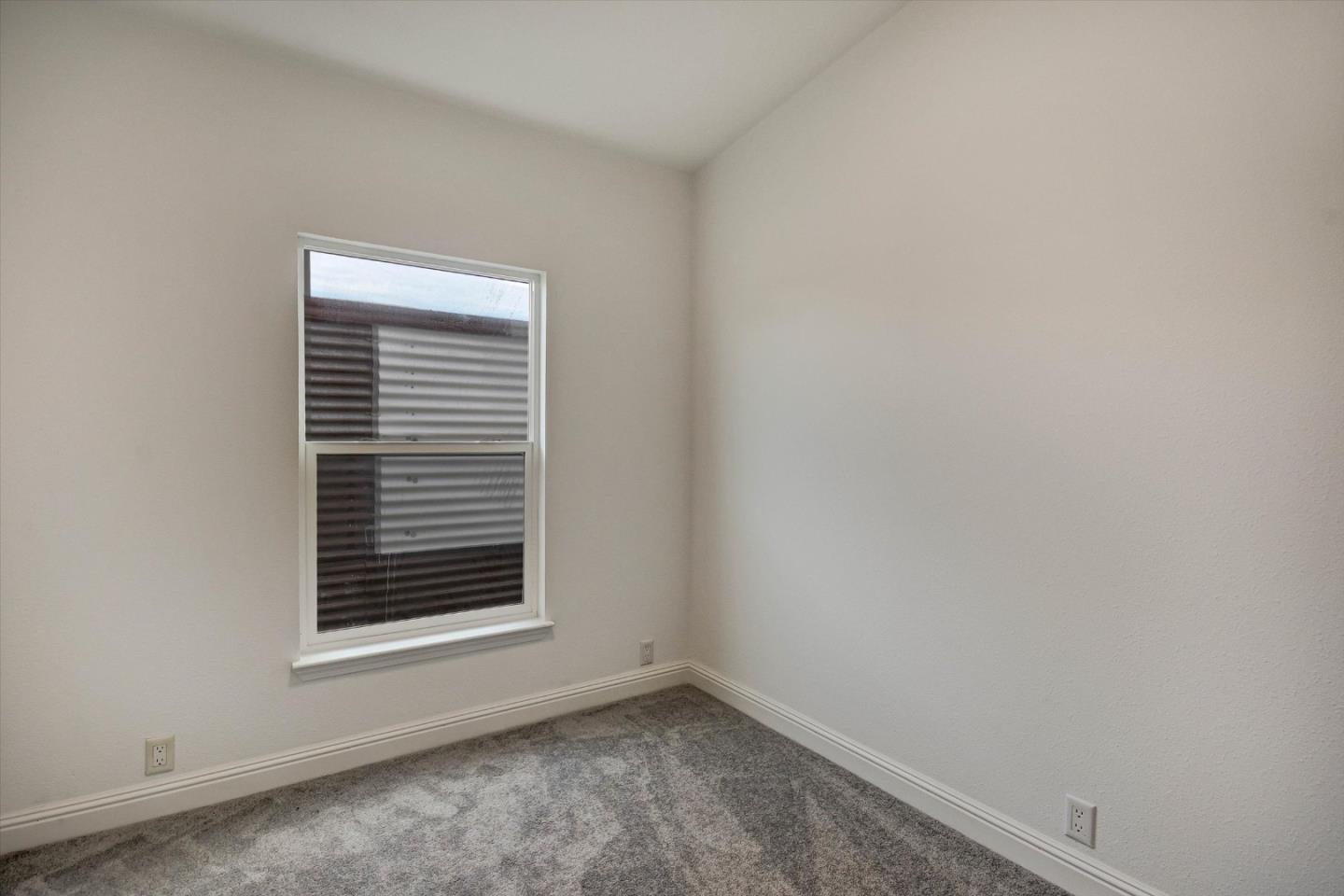 60 Wilson Way, Unit 117 Milpitas, CA 95035 - Photo 14 of 29 a view of an empty room with a window