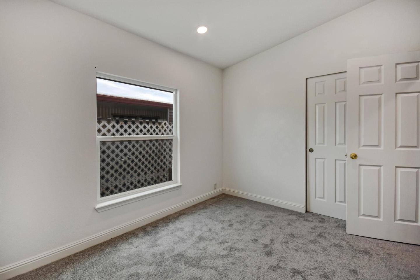 60 Wilson Way, Unit 117 Milpitas, CA 95035 - Photo 18 of 29 a view of an empty room with a window