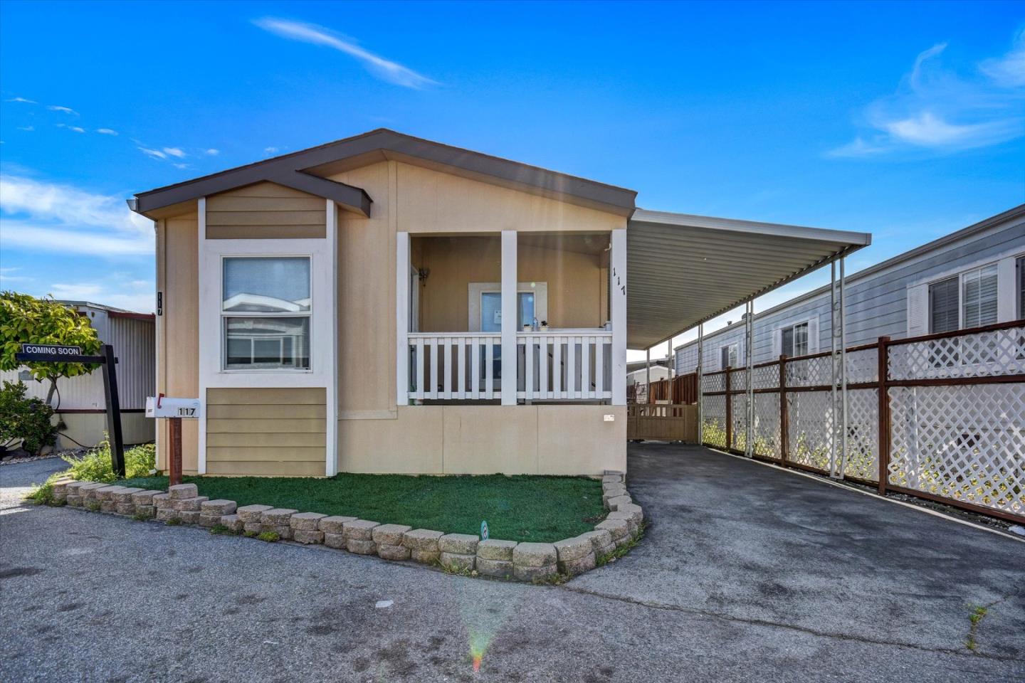60 Wilson Way, Unit 117 Milpitas, CA 95035 - Photo 2 of 29 a front view of a house with a yard