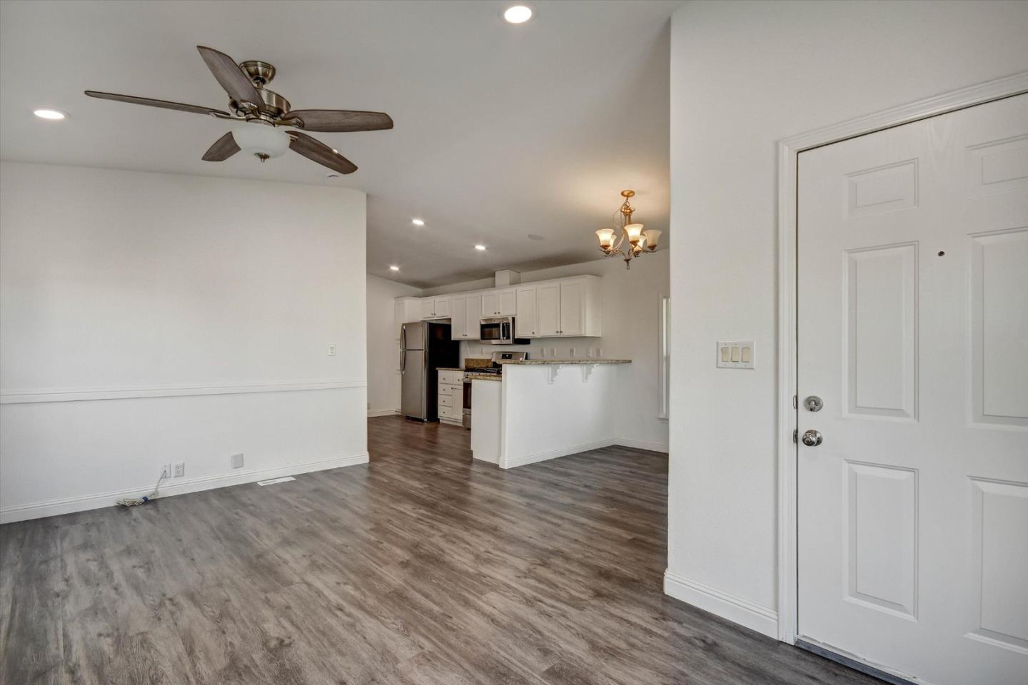 60 Wilson Way, Unit 117 Milpitas, CA 95035 - Photo 25 of 29 a view of a kitchen with a sink and wooden floor