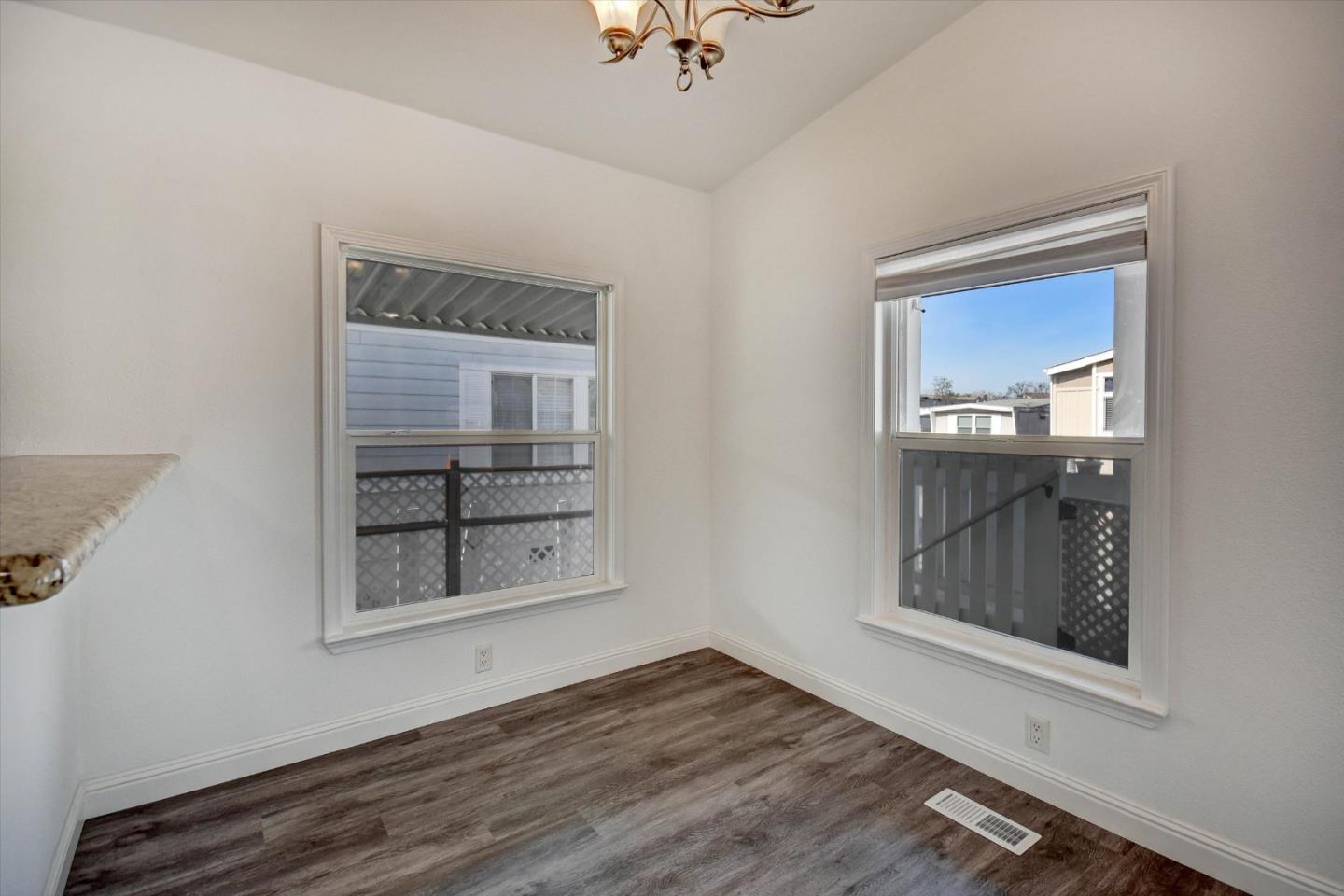 60 Wilson Way, Unit 117 Milpitas, CA 95035 - Photo 27 of 29 an empty room with a window and wooden floor