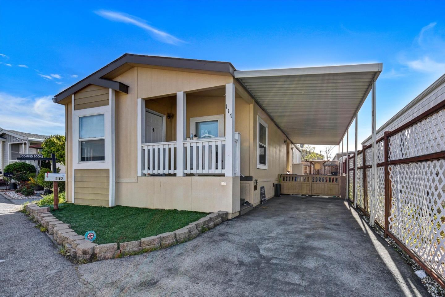 60 Wilson Way, Unit 117 Milpitas, CA 95035 - Photo 3 of 29 a front view of a house with garden