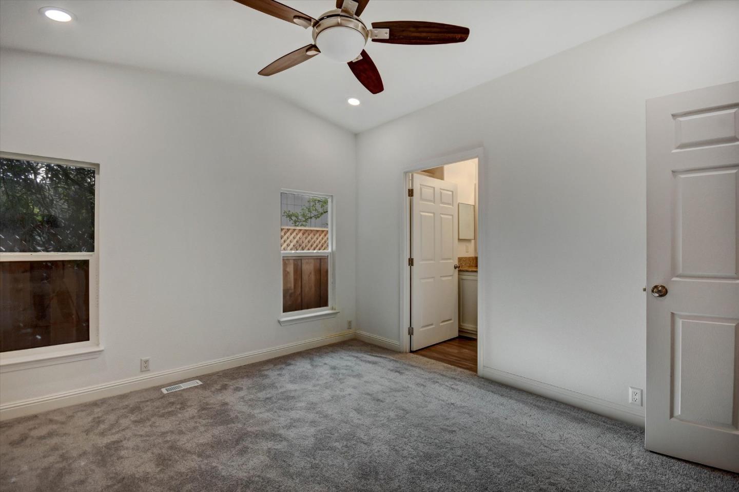 60 Wilson Way, Unit 117 Milpitas, CA 95035 - Photo 5 of 29 an empty room with closet and windows