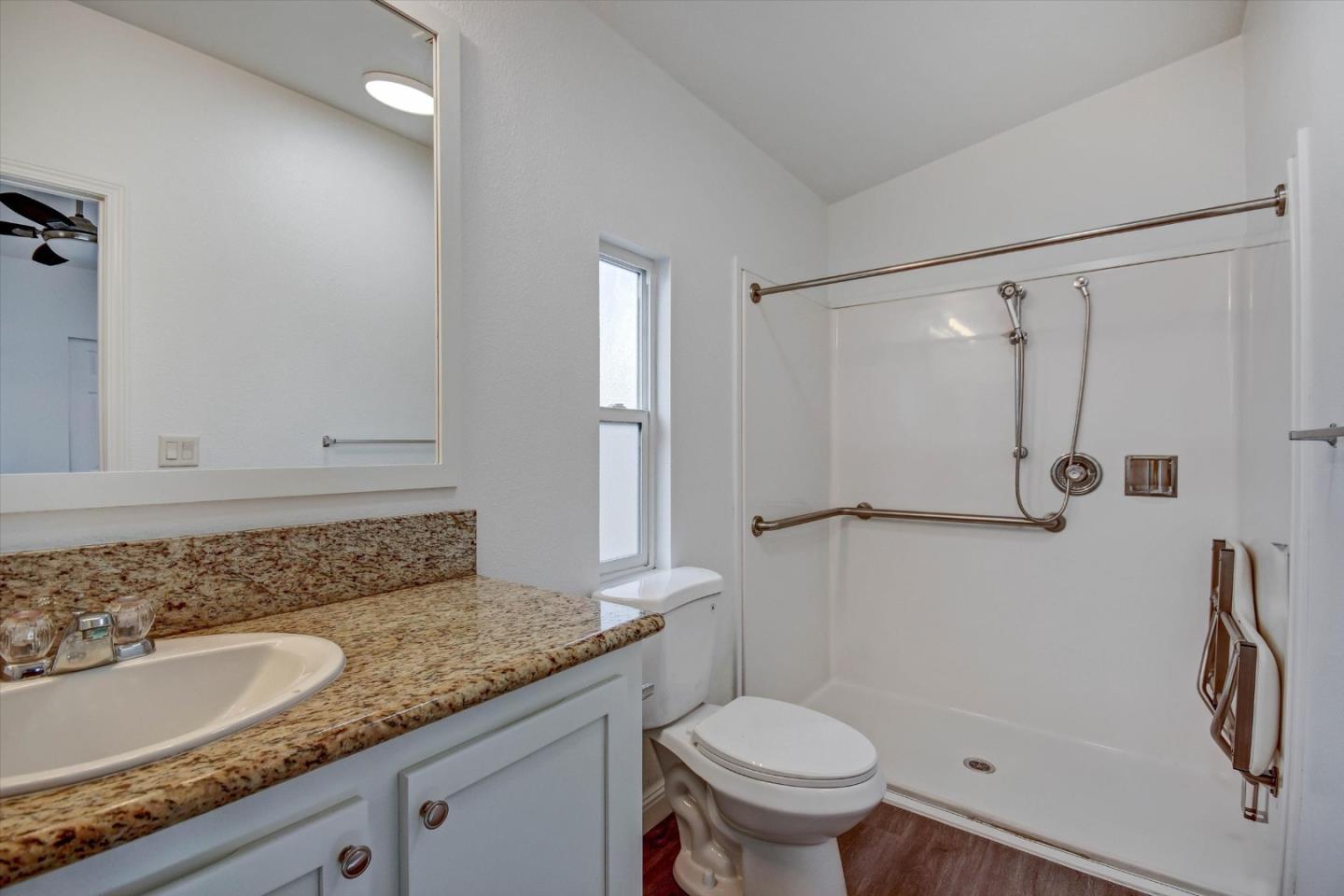 60 Wilson Way, Unit 117 Milpitas, CA 95035 - Photo 6 of 29 a bathroom with a granite countertop sink toilet and shower