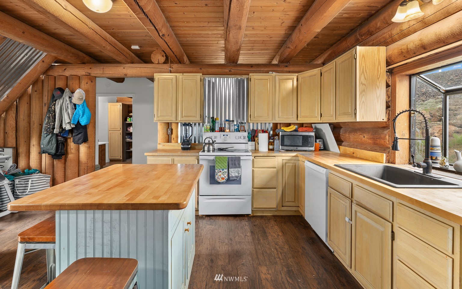 4301 Martin Road Northwest Ephrata, WA 98823 - Photo 14 of 40 a kitchen with sink cabinets and wooden floor