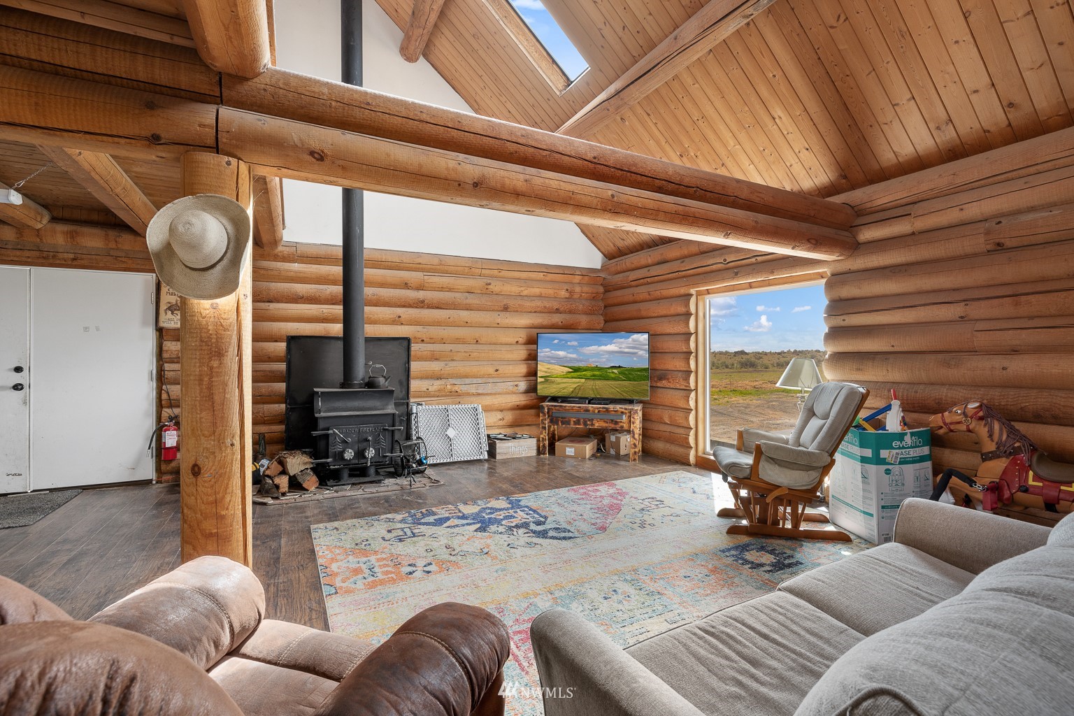 4301 Martin Road Northwest Ephrata, WA 98823 - Photo 19 of 40 a living room with furniture a flat screen tv and chairs