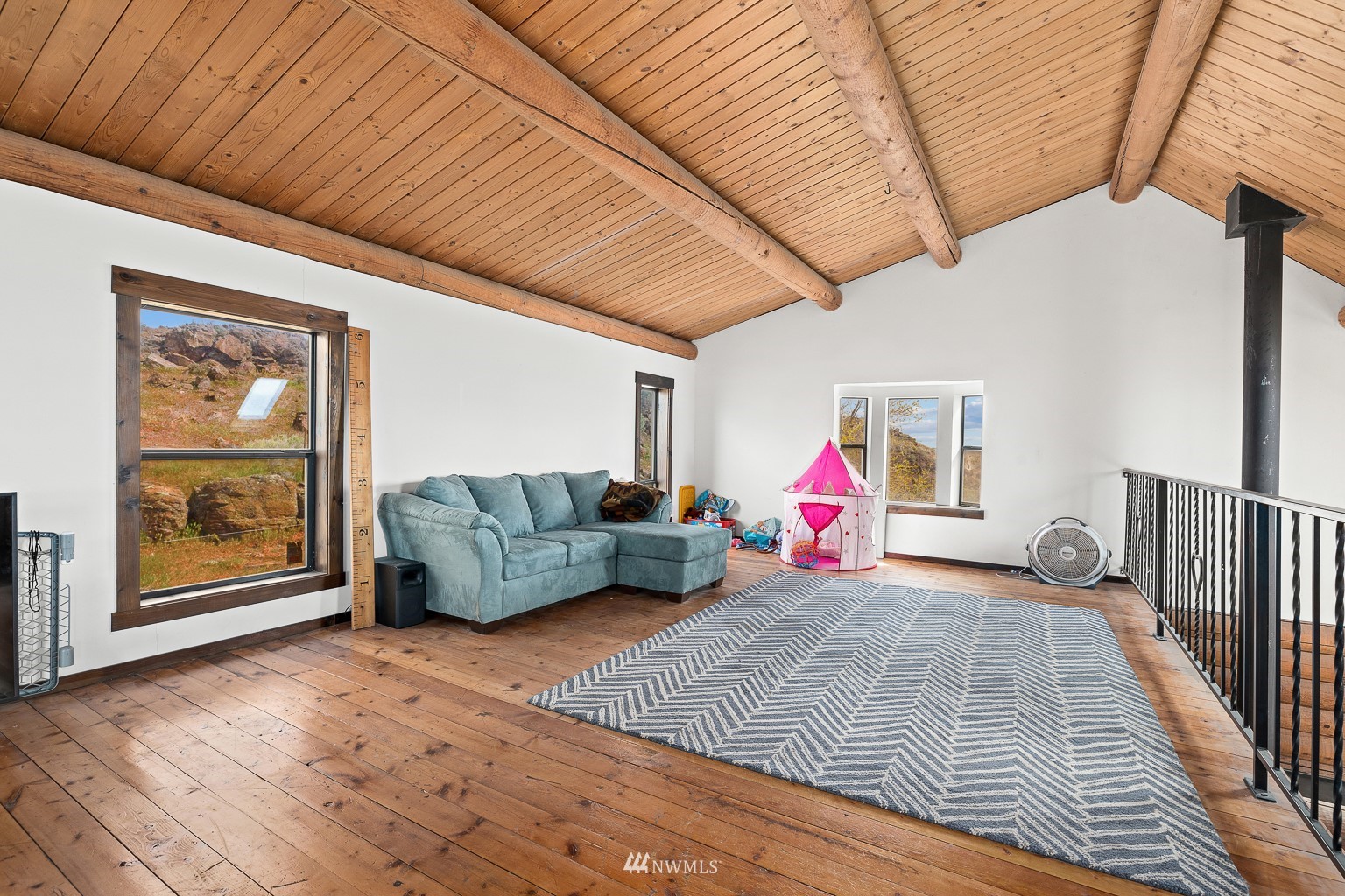 4301 Martin Road Northwest Ephrata, WA 98823 - Photo 24 of 40 a living room with furniture and a wooden floor