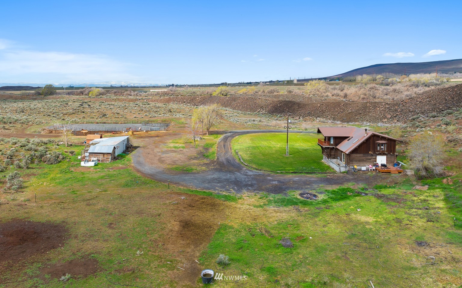 4301 Martin Road Northwest Ephrata, WA 98823 - Photo 4 of 40 an aerial view of a house with a yard and lake view