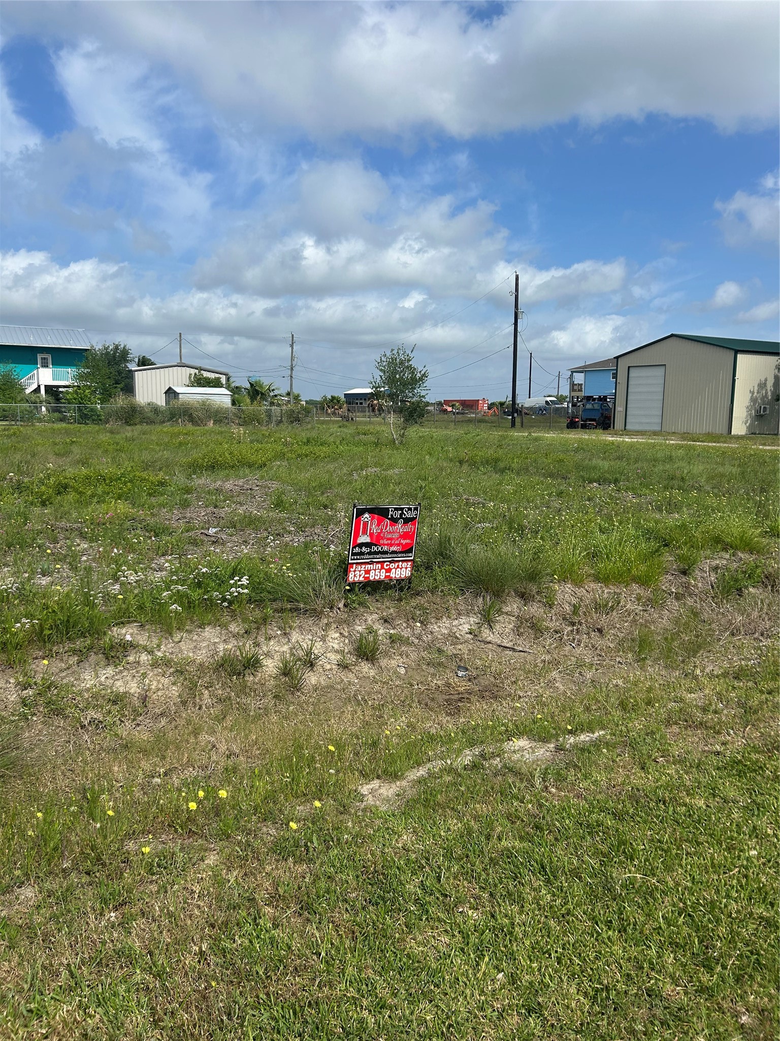 802 17th Street San Leon, TX 77539 - Photo 2 of 2 a green field with lots of trees in the background