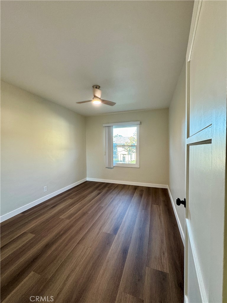 3402-3404 Gaviota Avenue, Unit B Long Beach, CA 90807 - Photo 14 of 20 an empty room with wooden floor and windows