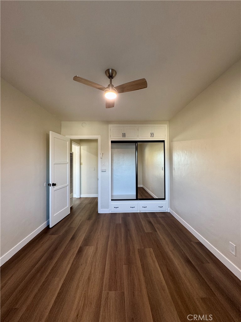 3402-3404 Gaviota Avenue, Unit B Long Beach, CA 90807 - Photo 15 of 20 a view of an empty room with wooden floor and a window