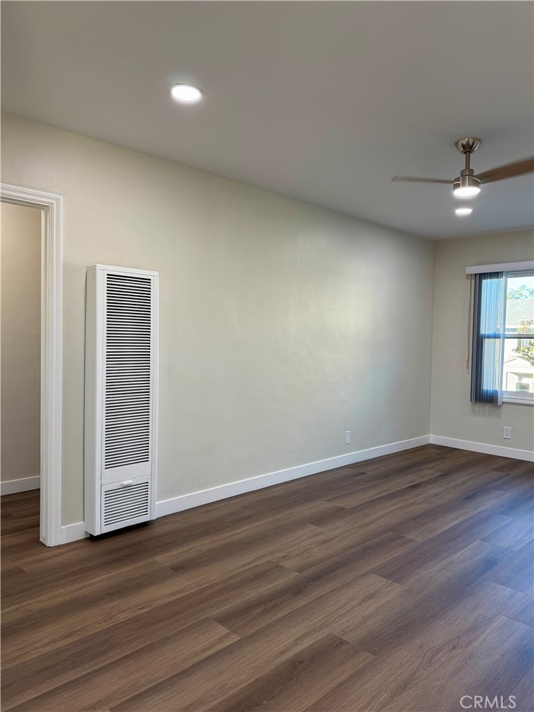 3402-3404 Gaviota Avenue, Unit B Long Beach, CA 90807 - Photo 9 of 20 an empty room with wooden floor and windows