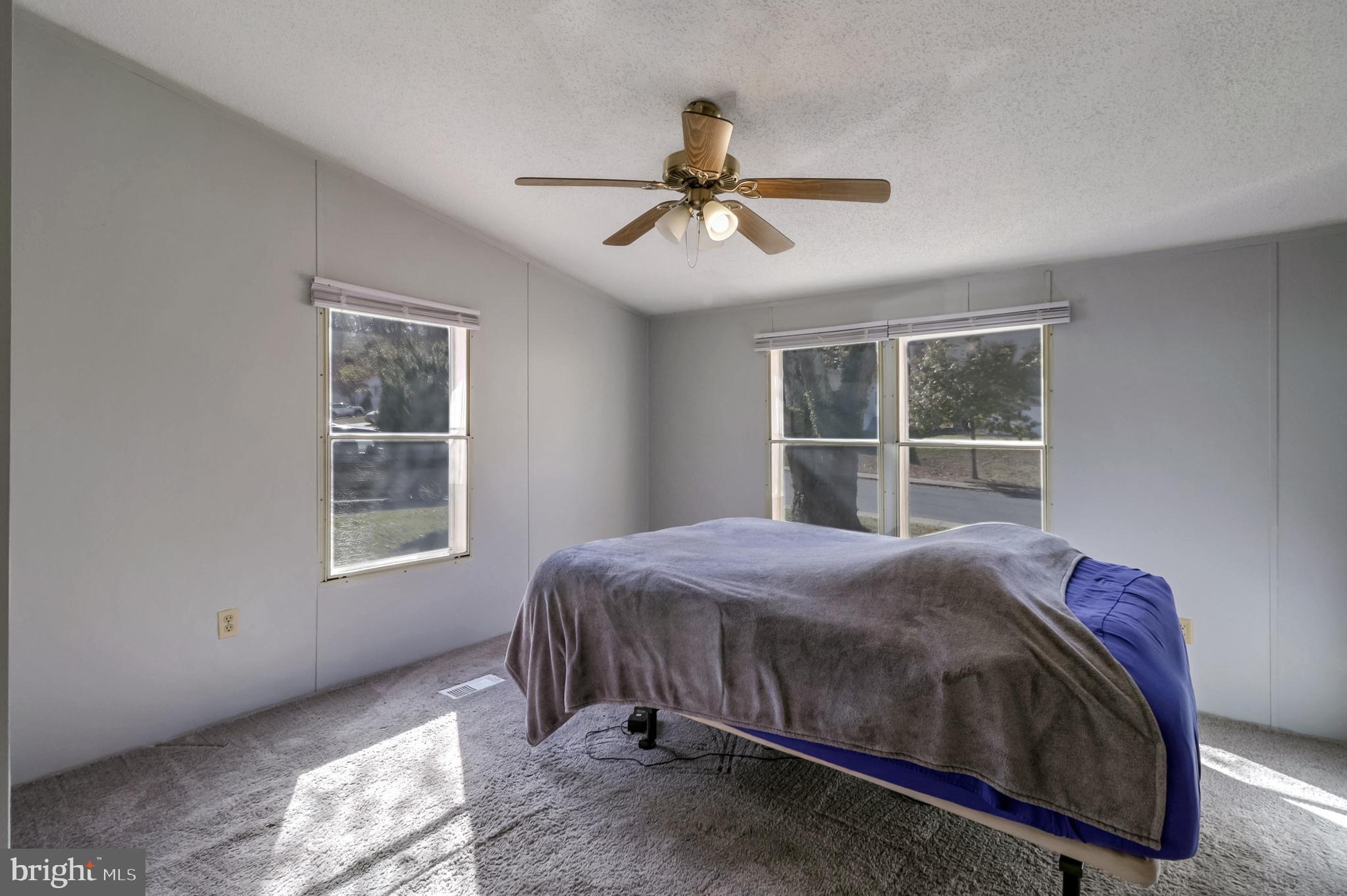 7810 Clark Road, Unit E15 Hanover, MD 21076 - Photo 11 of 20 a bedroom with a bed and a window