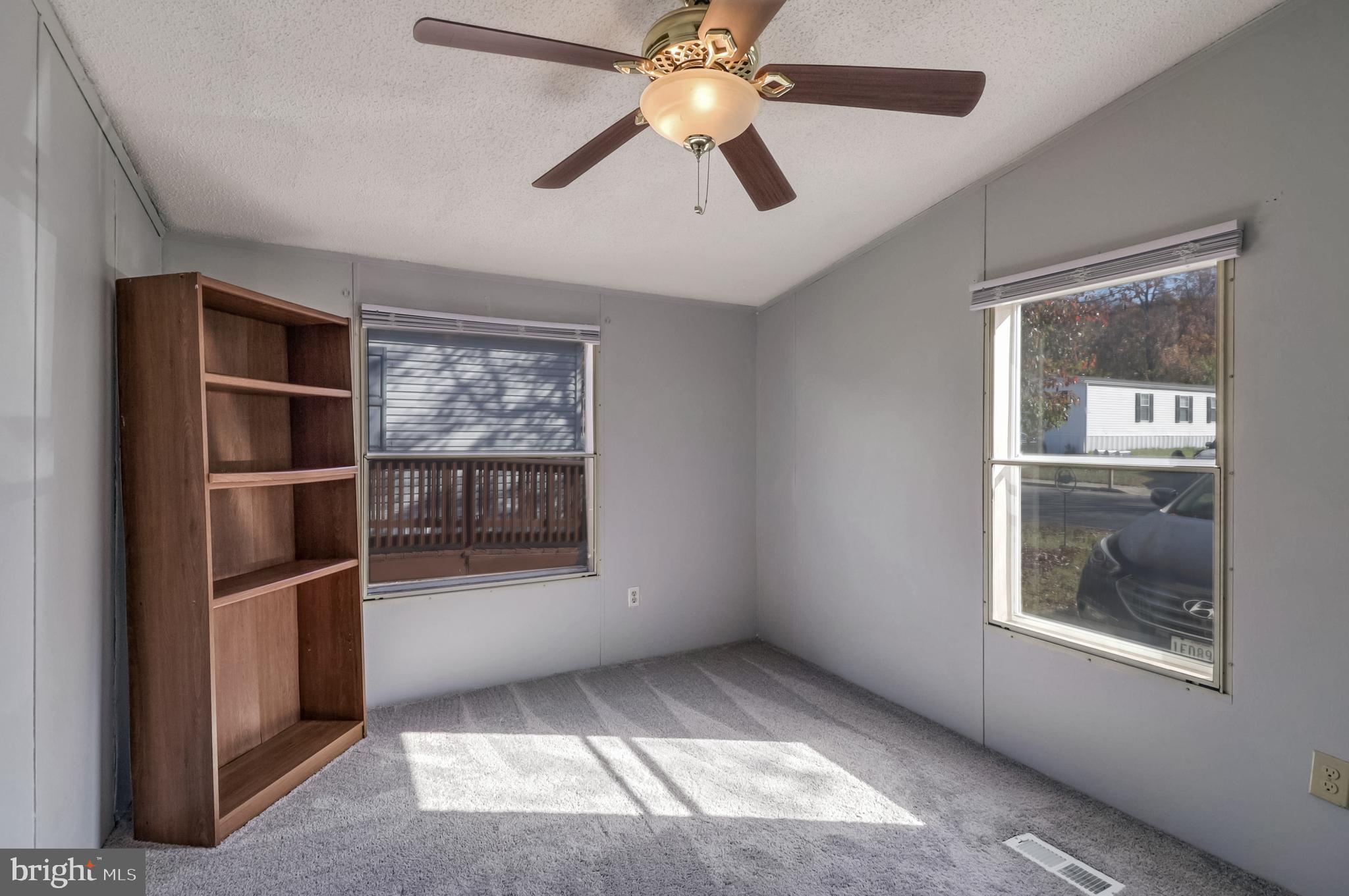 7810 Clark Road, Unit E15 Hanover, MD 21076 - Photo 20 of 20 a view of empty room with window and ceiling fan