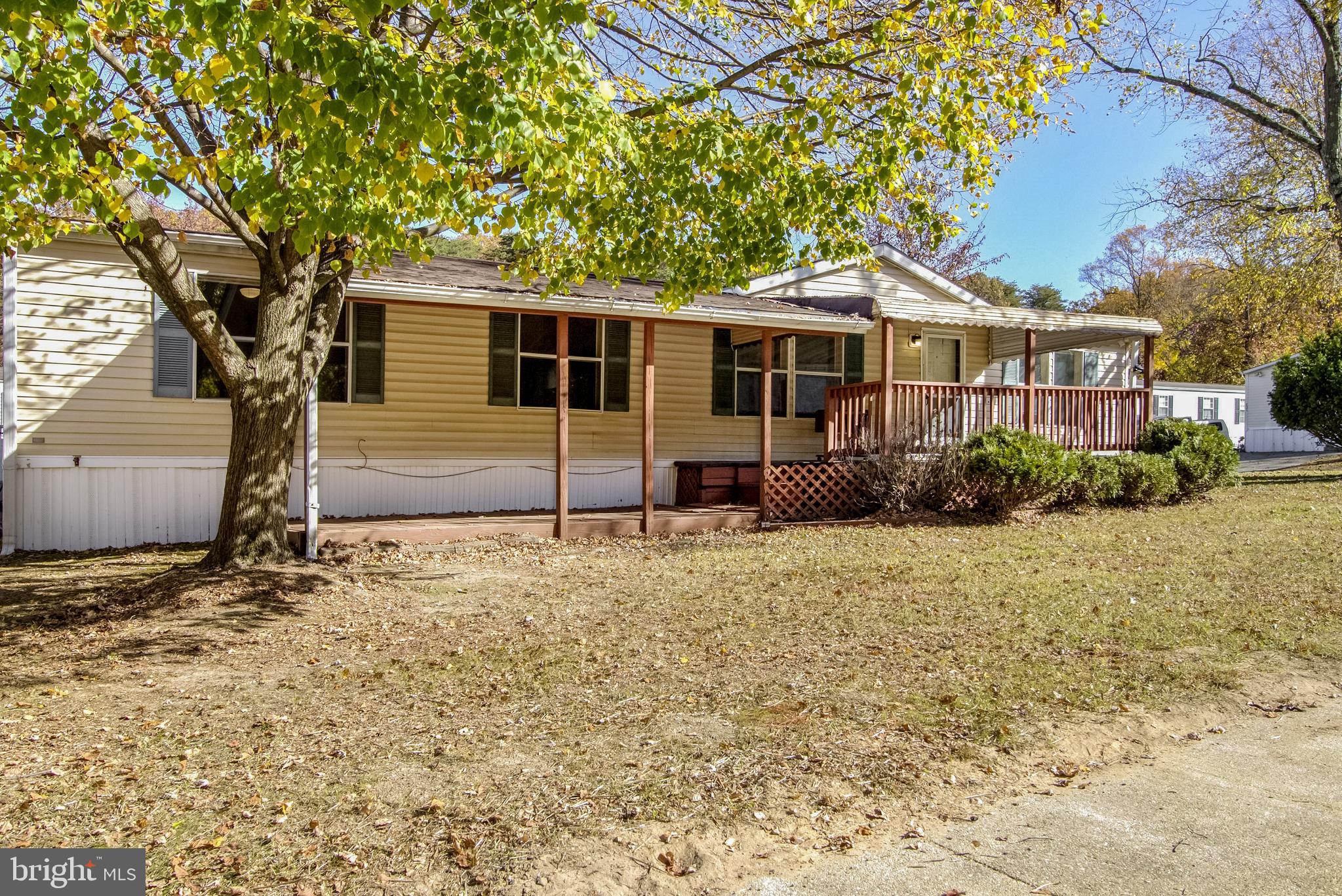 7810 Clark Road, Unit E15 Hanover, MD 21076 - Photo 2 of 20 a front view of a house with garden