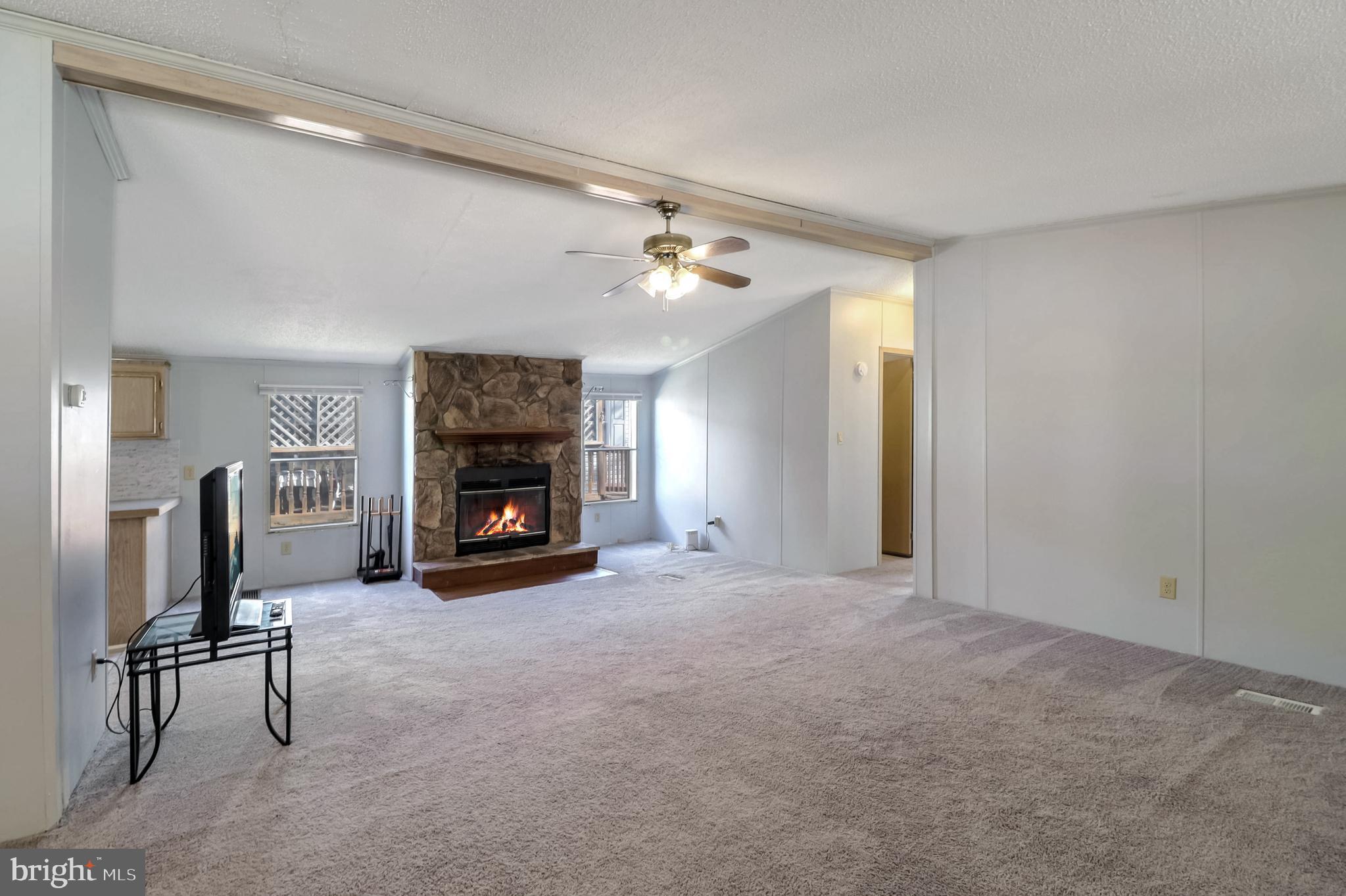 7810 Clark Road, Unit E15 Hanover, MD 21076 - Photo 4 of 20 a view of a livingroom with a fireplace and a window